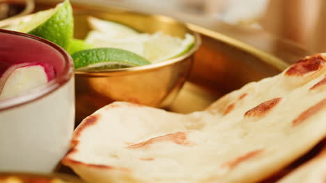 close-up view of a delicious spicy curry served in a colorful bowl with a spoon, ready for a tasty meal.