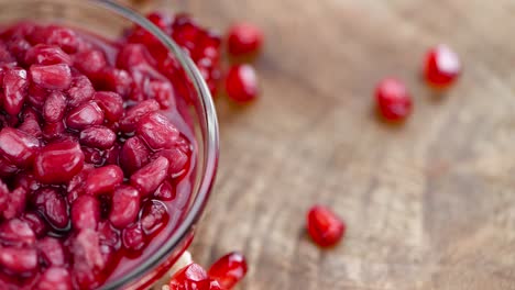 preserved pomegranate seeds on a rotating plate (seamless loopable)