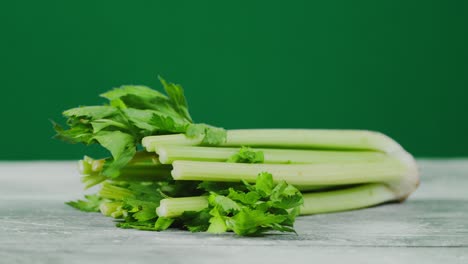 fresh bunch of celery on the table.