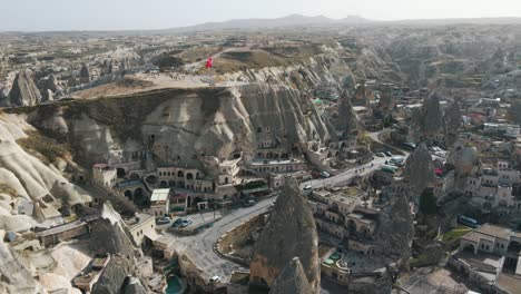 aerial shot of cappadocia hotels carved from stone rock, cave style