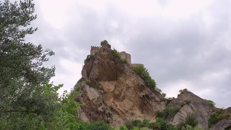 zoom out of roccascalegna in italy. low angle