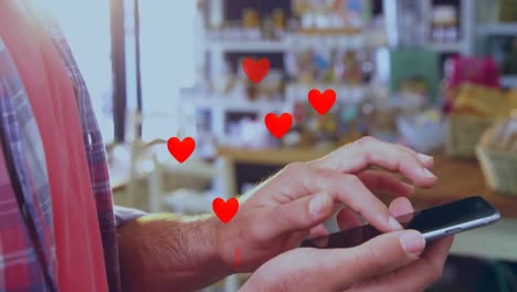 animación de corazones caídos sobre personas que utilizan terminales de pago