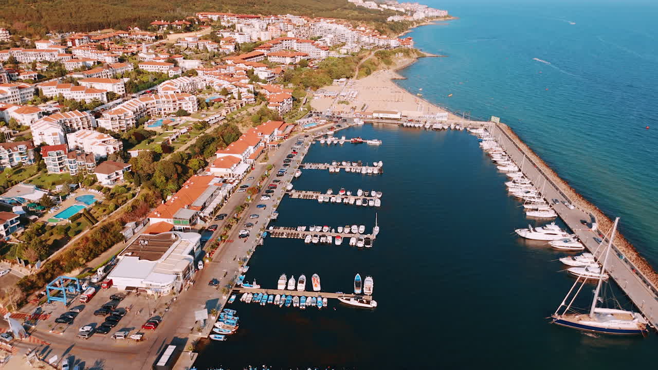 Developed tourist infrastructure on the coast of the Black Sea. Drone footage over the yacht club in Sveti Vlas, Bulgaria on sunny daytime
