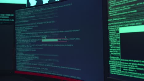 Code On Multiple Computer Screens And Downloading Data, Cyber Attack