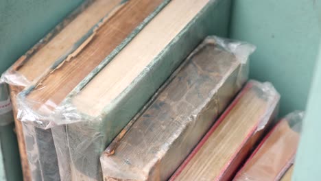 close-up of old books on a shelf