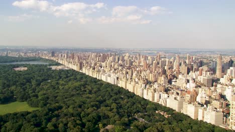 new york city with skyline and central park, showing the contrast between urban life and green spaces, aerial view