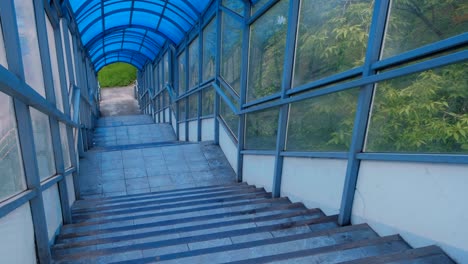 stairs to elevated pedestrian crossing from the inside. safe passage across the road.