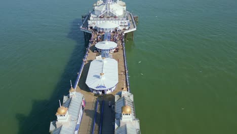 Flying-above-and-over-Eastbourne-Pier-with-walking-people