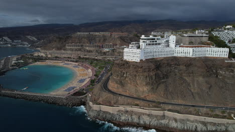 fantastic aerial panoramic shot of amadores beach and the big hotels in the area, during sunset on the island of gran canaria