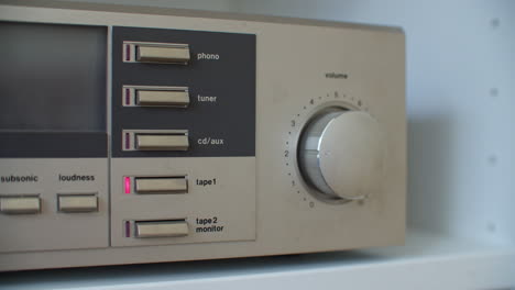 Close-up-shot-of-switching-the-modes-of-an-old-vintage-stereo-system