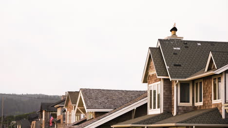 slow tilting shot revealing luxury houses situated near canon beach, oregon