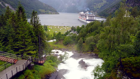 thundering fossevandring waterfall norway pan from beautiful geiranger fjord to top of falls and hotel 4k prorezhq