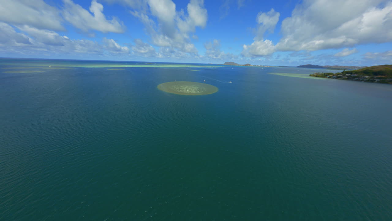 Flying Towards Sandbar at Kaneohe, Oahu, Coral and Atolls Visible From Above, Sailboats and Blue Waters Below