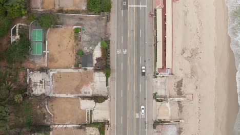 aerial bird's eye shot flying over burned properties along pacific coast highway near las flores canyon after the wildfire in malibu, california. 4k