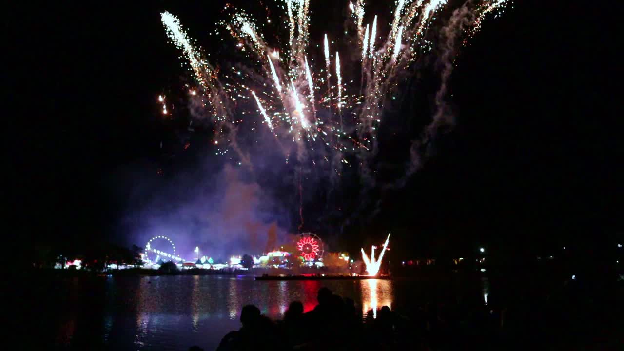Fireworks exploding over county fair waters