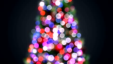 blurred christmas tree lights blinking in defocused bokeh. greeting background seamless 3d animation. merry christmas and happy new year celebration concept.