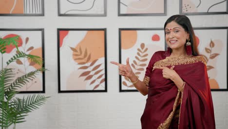 Indian-woman-pointing-at-Copy-space