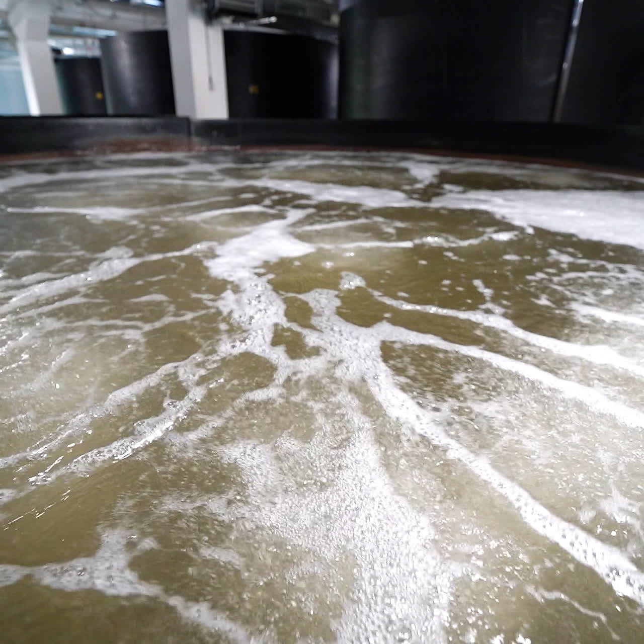 Prawn farm close-up. Oxygen water with aerator inside the shrimp farm.