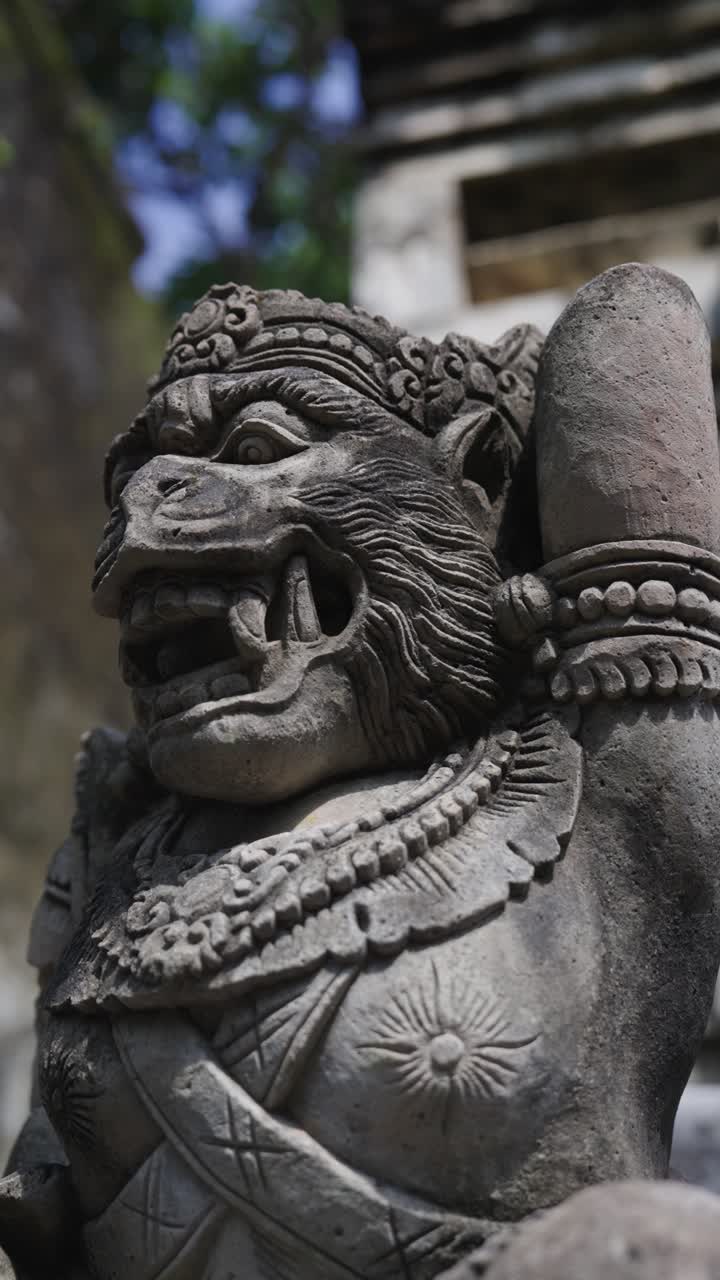 Ancient statue with monkey head, close up vertical view