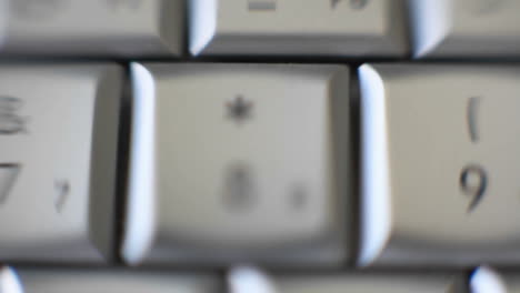 The 8 key on a keyboard quickly comes into focus