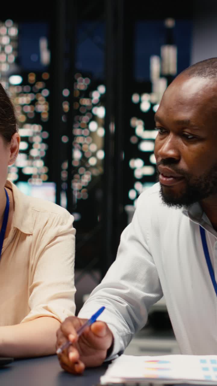 Vertical Video Diverse group of business professionals working together in workspace