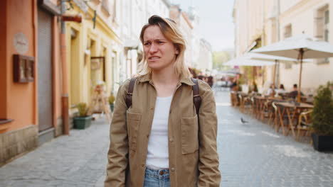 confused woman feeling embarrassed about ambiguous question no idea clueless uncertain city street