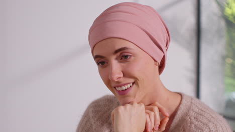 smiling woman patient wearing headscarf undergoing chemotherapy treatment for breast cancer getting good news at meeting with oncologist or doctor in hospital 2