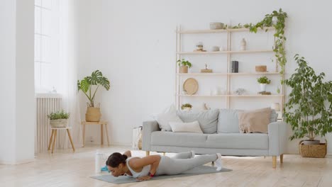 woman doing plank exercise at home