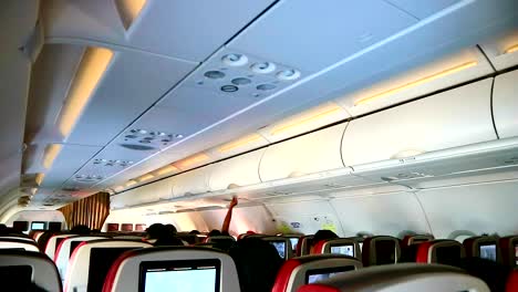 passengers inside commercial airplane cabin