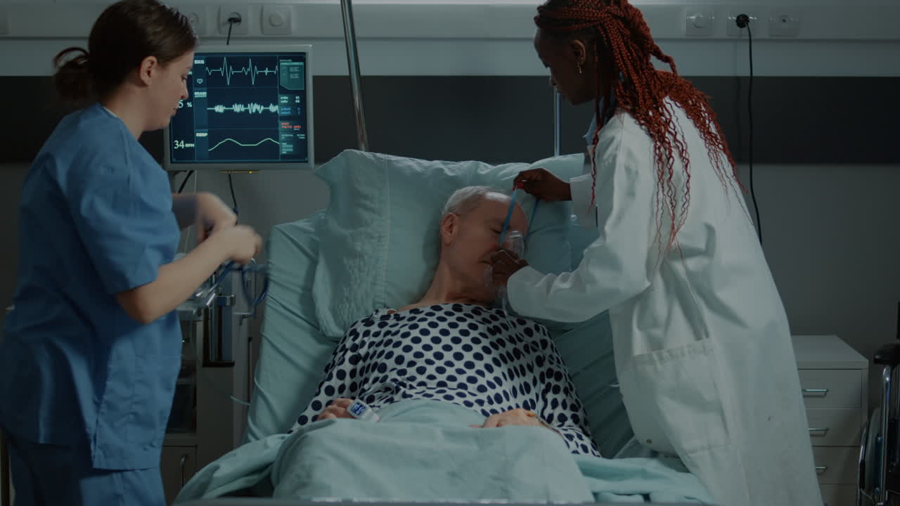 Multi ethnic nurse and doctor helping sick patient