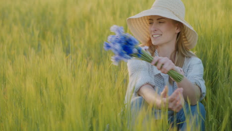 Smiling Woman with Blue Flowers in Fields