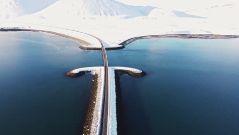 snaefellness peninsula aerial footage winter iceland landscape with blue water and white snow covered landscape