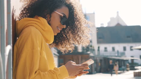 young woman using a phone outdoors