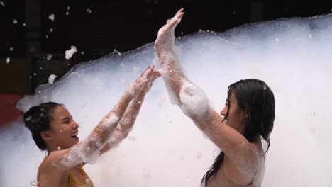 girl playing in bubble pool with fun and joy