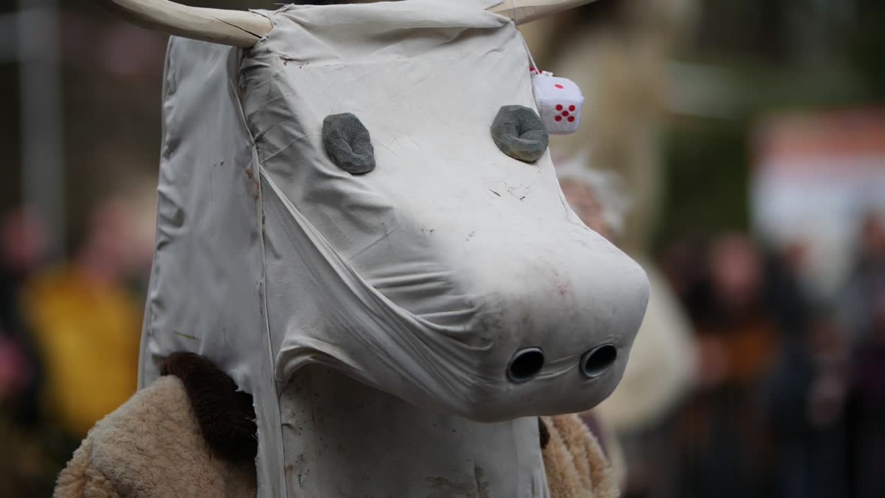 Fake white cow head mask with dices on its horns