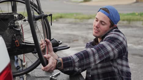 disabled man assembling parts of a bicycle