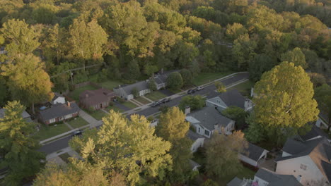 overhead aerial view looking down on small suburban houses with a tilt up to reveal the horizon