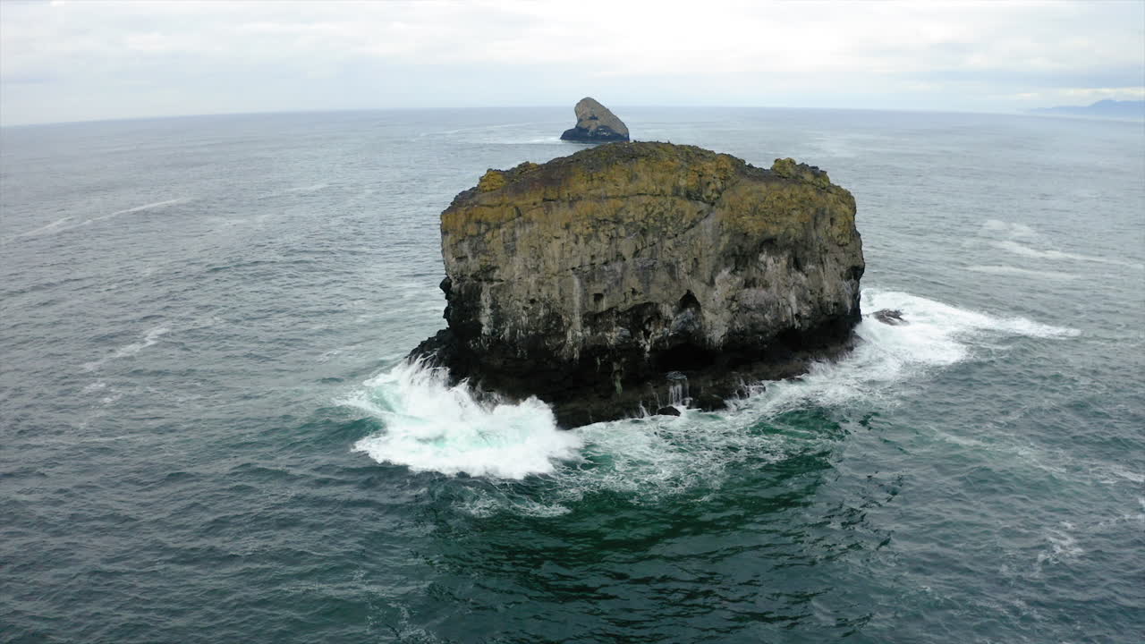 Large Sea Stack in Choppy Ocean with Distant Horizon