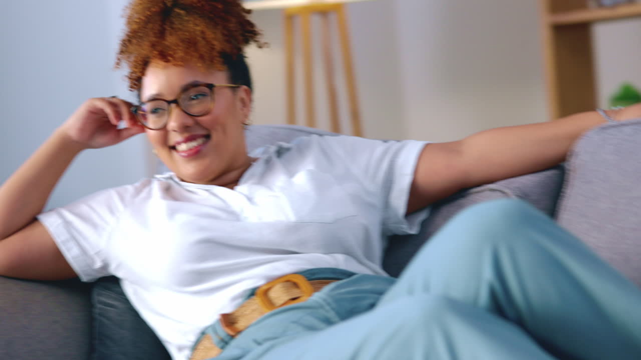 Black woman, sofa and laugh for comic movie