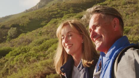 Active-senior-couple-hiking-in-forest