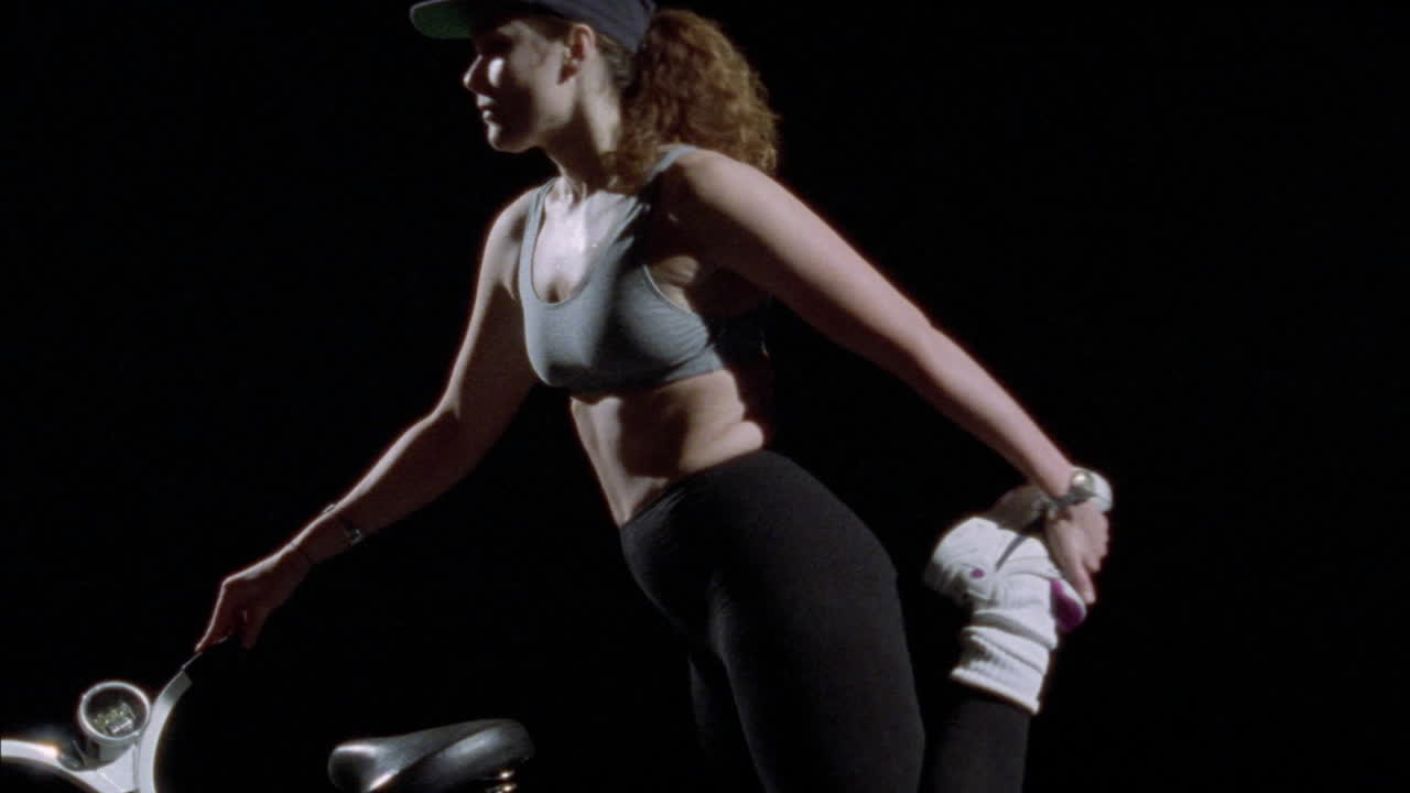 A woman does stretching exercises