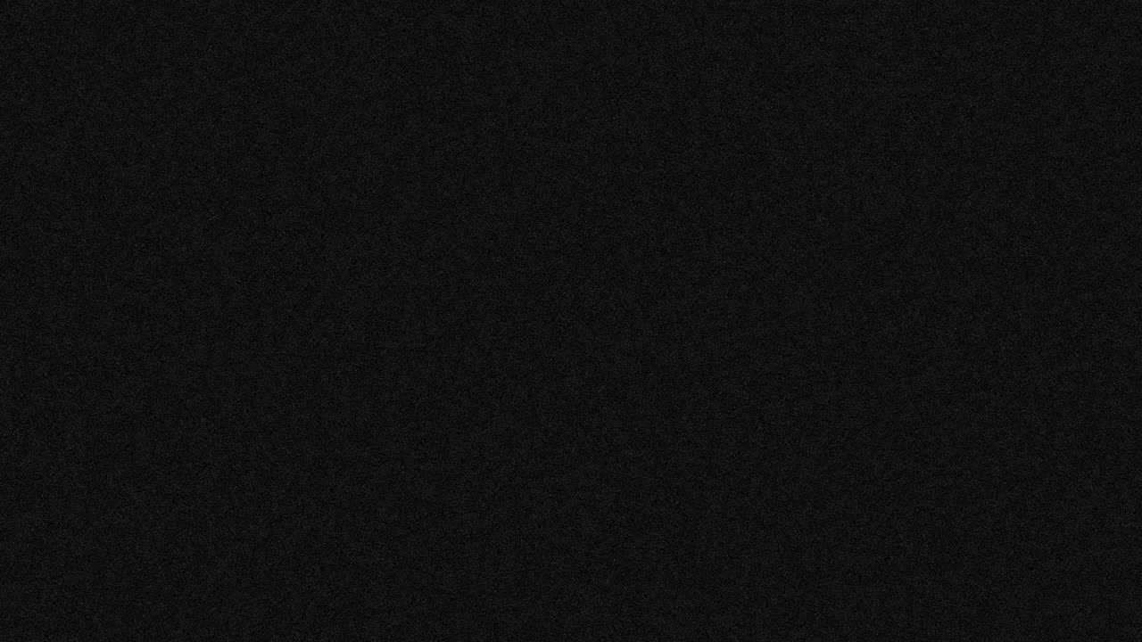 Animation of dark grey abstract noise specks moving fast on dark grey background