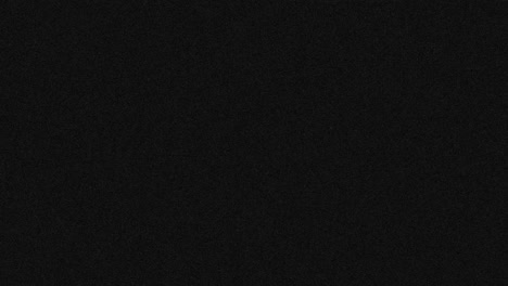 animation of dark grey abstract noise specks moving fast on dark grey background