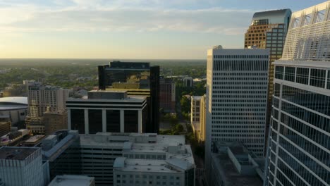 Backwards-Shot-Reveals-Modern-Skyscrapers-in-Downtown-Area-at-Sunrise