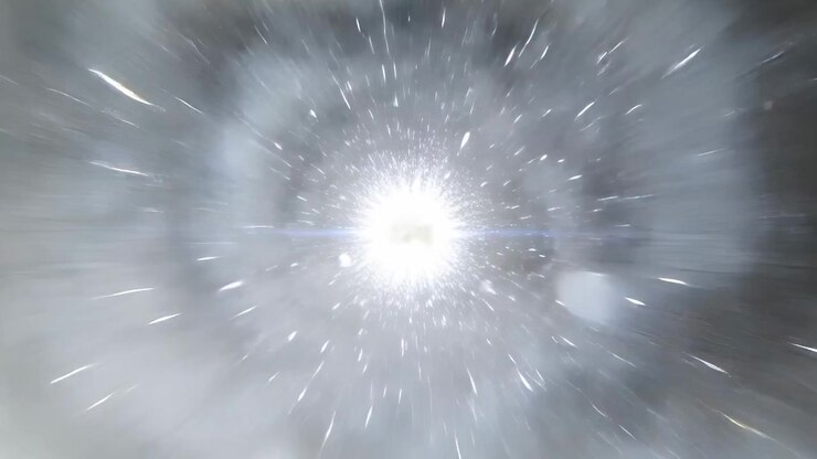 Accelerating central light pulling particle halo inward in simulated tunnel, drawing viewer forward