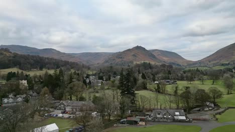 lake district national park landscape cinematic drone aerial video footage of grasmere vlllage, probably cumbria’s most popular tourist village