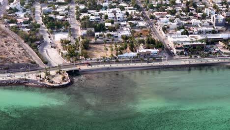 shot of pier and ocean different colors in la paz bay in mexico