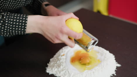 grate lemon peel into the dough of a calabrese dessert