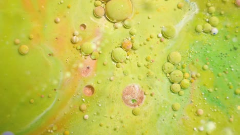 4k footage. colorful liquid ink in water. color abstraction. bubbles paint in the water. slow motion of paint in water. multicolored background liquid paint