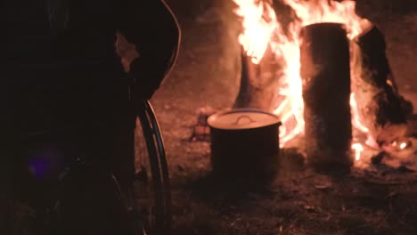 people with disabilities sitting around a bonfire